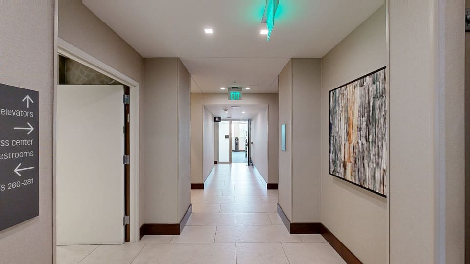 Corridor to Elevators & Fitness Center — 3D tour